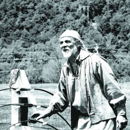 In frontiersman garb, GSBPA President Doug Siedenburg of Califon taught archery basics to the kids and each one had a chance to shoot at a target.