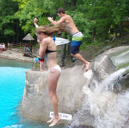 Only the bravest attempt taking a leap of faith into the pool at the Canyon Cliffs. The water is 16 feet deep below the 23-foot high cliff. Holding oneþÄôs nose while jumping is an option that some like to take.