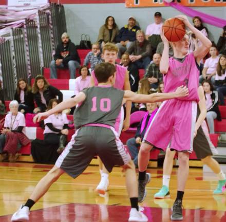 Surrounded by High Point defenders Vernon's Kyle Dunbar handles the ball during a shot attempt.