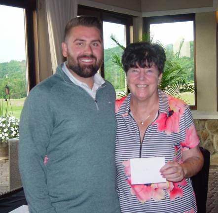 [Women’s Longest Drive Winner Buffy Whiting (right) with Crystal Springs’ Tyler Borkowski]