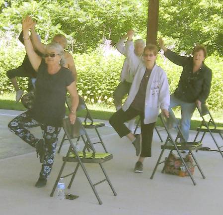 The yoga group attains tree pose on a gorgeous sunny day (Photo by Janet Redyke)