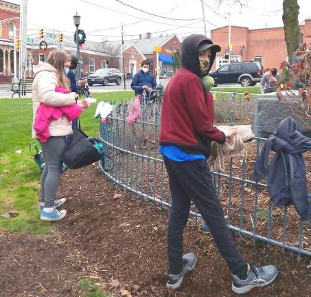 Scouts warm the community with Dress the Fence project