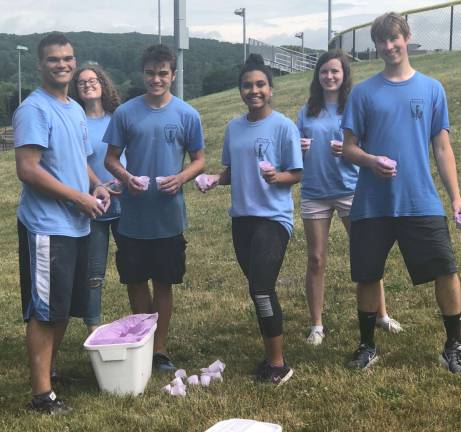 PHOTOS BY ROSEMARY MCGUIREFrom left are, Ethan Metz, Audrey Perich, Noah DeVelez, Aila Altunbilek, Caitlin Mayo and Robert Wallace. They represent about half of the members who planned and executed the activities