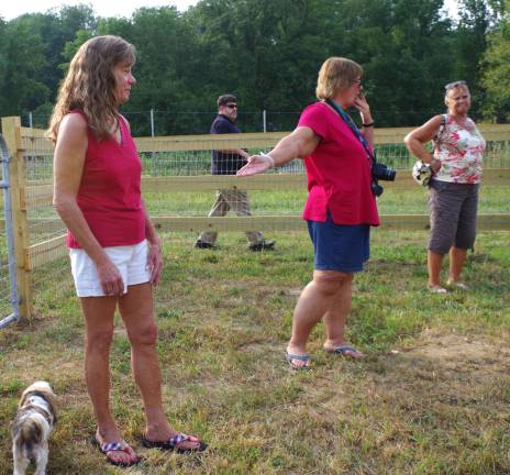 At center, Barbara Green, the president of DOGS of Vernon introduces Janet Peet of Florida, N.Y.-based Canine Clippe,r all breed grooming salon. Canine Clipper donated the new Small Dog Park addition to the Vernon Dog Park.