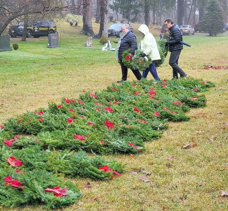 Families with fallen military members were asked to come forward first to lay wreaths.