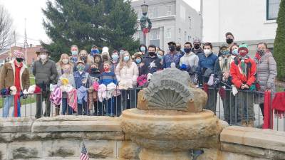 Scouts warm the community with Dress the Fence project