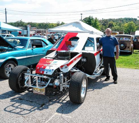 <b>Dave Sipley poses with a modified car.</b>