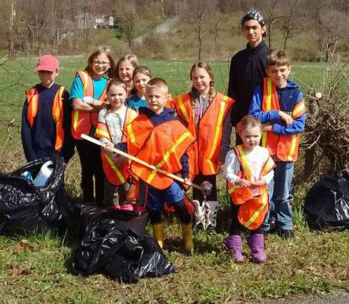 Students from Sussex Christian School participated in a Wantage Township Clean Communities Program roadside clean-up to help raise funds for their school in the Challenge of the Talents Fundraiser .