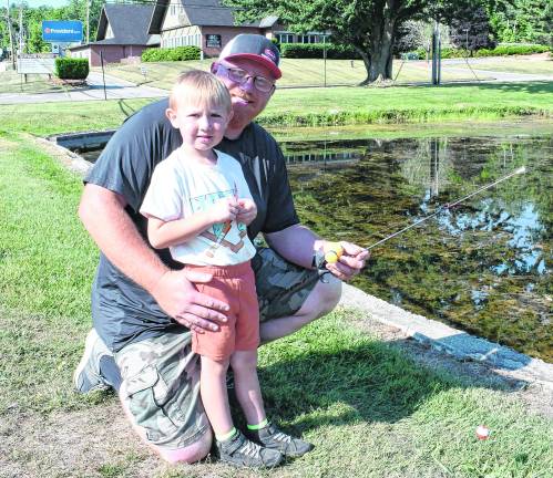 <b>Tanner and Robert Lau of Vernon fish.</b>