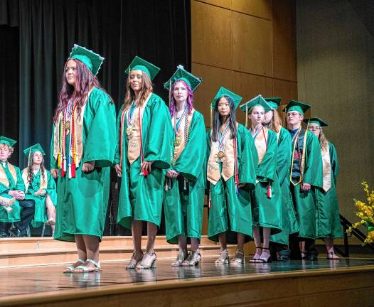 Graduates line up to receive their diplomas.