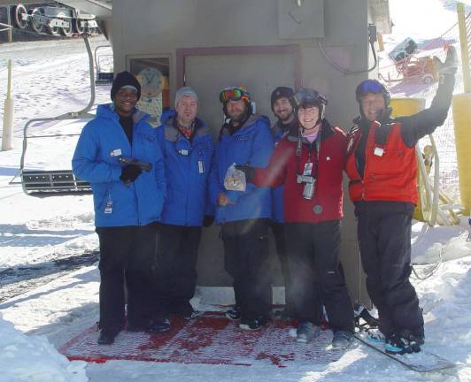 Buffy Whiting gives MC Lift Operations Staff the traditional &#xfe;&#xc4;&#xfa;Christmas&#xfe;&#xc4;&#xf9; Cookies as all celebrate the opening day. From left, Cornelius Schneider, Richard Veen, Asst. Lift Supervisor Kenny Hoyt, Ed Noonan, Buffy and Patroller Keith Higgins.