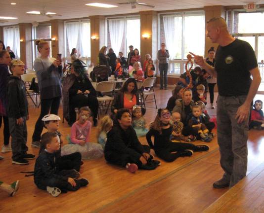 Mr. Johnny of Rizzo&#x2019;s Wildlife World discusses Cornflake, the Corn snake with the group.