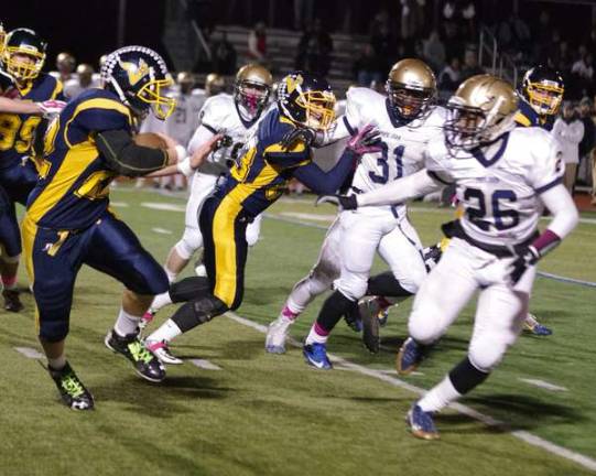 Vernon wideout Luke Venskus carries the ball during a kick return.