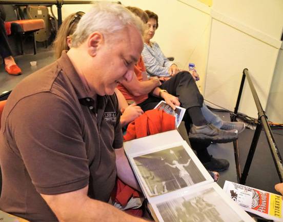 PHOTOS BY VERA OLINSKIGodspell 2012 Broadway revival producer Eliot Sash shows photos of singing &quot;Light of the World&quot; in the original New York road company.