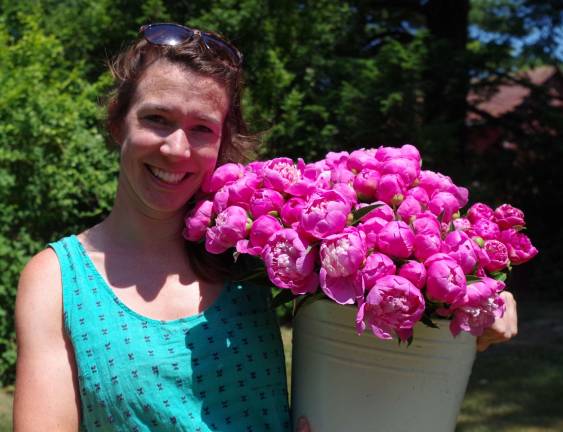 Event coordinator and garden manager Quill Teal-Sullivan had just returned from the greenhouse with a bouquet of freshly cut peonies.
