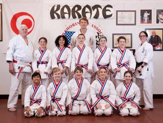 Front row, from left, are Luis Santiago, Harvey Wolverton, Justin Passaro, Colby Remington and Brianna VanHaste. Back row, from left, are Rhyleigh Tarrant, Teagan Brown, Layne Remington, Bryce VanHaste and Emmett Lawlor. The instructors are Sensei Tom Shull, standing at left; Sensei Cody Williams; and Sensei Monica McGovern. (Photo by Jose Miranda)