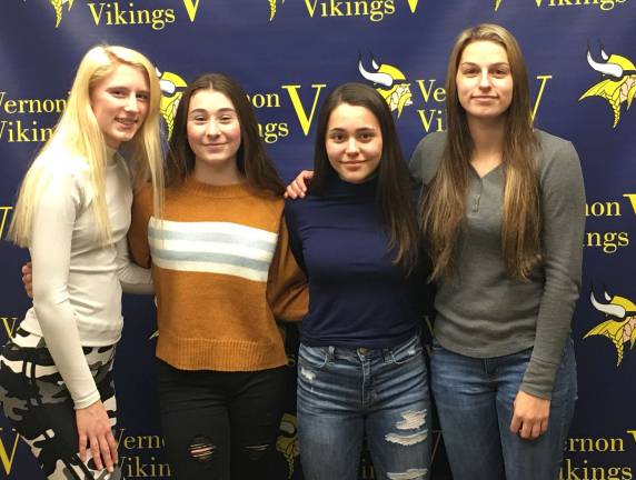 The 4x200 relay team on the girls' indoor track team.