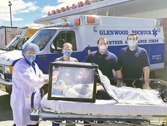 Ambulance volunteers build patient barriers for the hospital