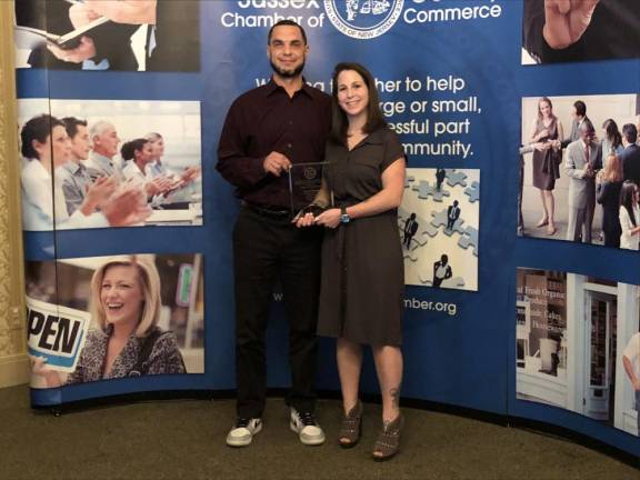 PIX4 Ben and Heather Davey, founders of Benny’s Bodega in Newton, hold the Quality in Living Award from the Sussex County Chamber of Commerce. (Photo by Kathy Shwiff)