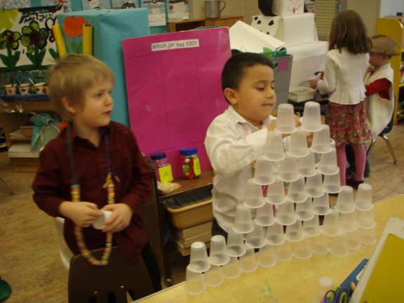James Gould, age 5, and Joshua Ascencio, age 5, stack 100 cups.