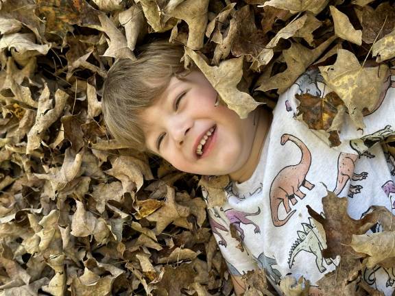 Playing in a pile of leaves in Grammy and Papa’s yard in Chester. Photo submitted by Debbie Quackenbush.