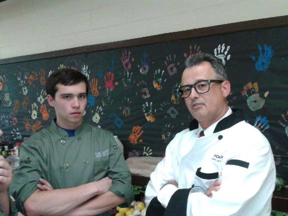 Student Steve Owens gets ready to thrown down with Mentor Chef Assistant Principal Jim Trusa.