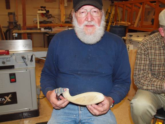 Henry J. Hanzo Jr. of Oak Ridge shows a carving of a fish. Hanzo is the President of the Jersey Hills Wood Carvers.