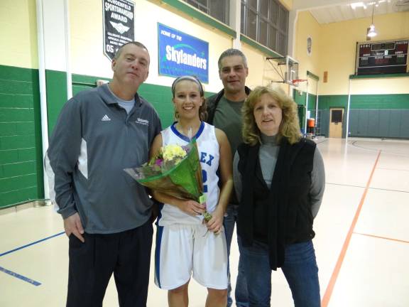 Kelsee Tironi with her coach and parents.