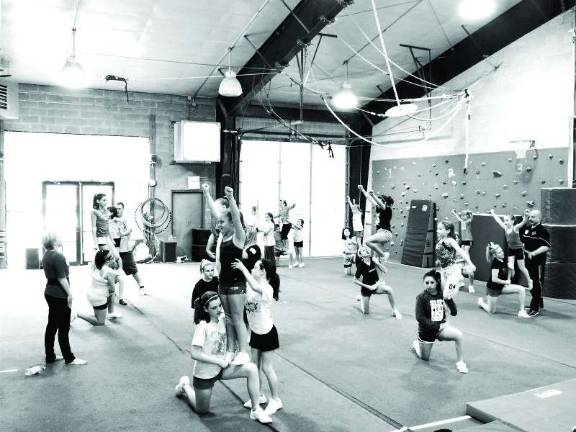 Giant Gymnastics cheerleaders practicing routines.