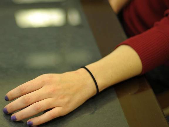 A recovering heroin addict, alias: "Tess," shows her hand. Tess started using the drug in her thirties. She entered rehab after two years of use.