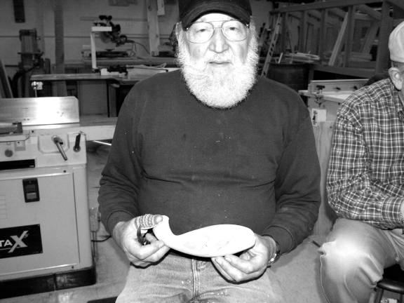 Henry J. Hanzo Jr. of Oak Ridge shows a carving of a fish. Hanzo is the President of the Jersey Hills Wood Carvers.