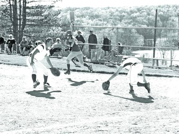 Photo by George Leroy Hunter High Point players race to a ball hit in the infield.