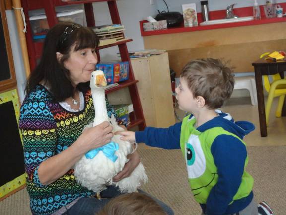 Photo by Scott Baker Wyatt Giampino, 3, of Vernon, makes friends with Oliver.