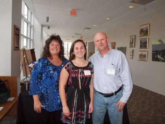 Wallkill Valley Regional High School scholar athlete nominee Emily Stukenborg poses with her parents.