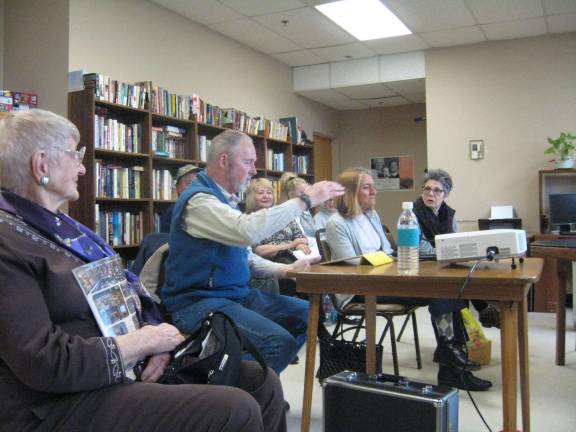 PHOTOS BY JANET REDYKEDon Traylor (center) and some of the Golden Lunch Bunch Garden Club begin a Power Point talk on moths, major pollinators.