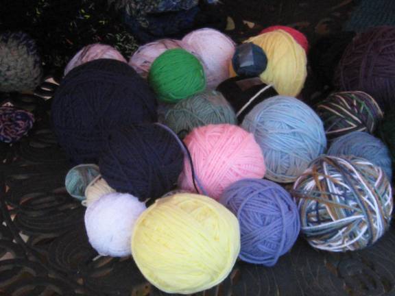 Donated wool awaits transformation into items of beauty and comfort.