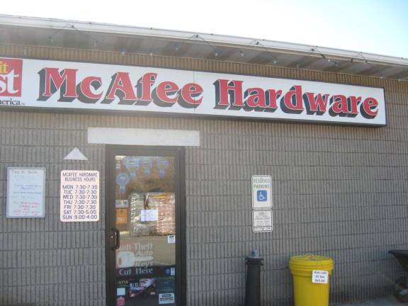 PHOTOS BY JANET REDYKE Customers are welcomed to the 25- year business- McAfee Hardware.