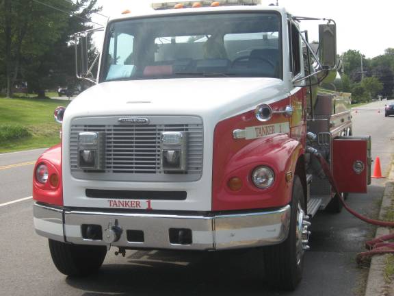 Tanker truck stands waiting for the big soak.