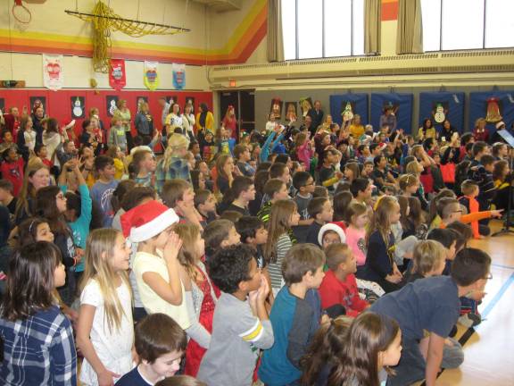 PHOTOS BY JANET REDYKE Excited Cedar Mountain students watch the robot shoot baskets in the school&#xfe;&#xc4;&#xf4;s gym.