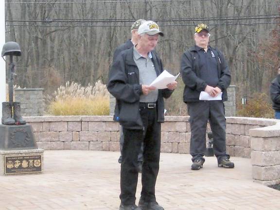 Vietnam Veterans Chapter 1002 President John Harrigan conducts the Veterans Day ceremony at the cemetery (Photo by Janet Redyke)
