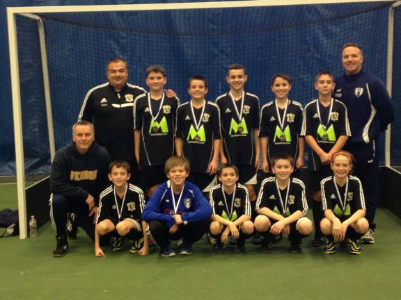 The Vernon Titans U-12 travel soccer team participated in the Drew Men's Soccer Annual Indoor Tournament on Jan. 12, winning the gold with wins over madison, Long Valley, Dover United A and Dover Unitd B. Pictured in back, from left are: Coach Skounakis, Will Jurewicz, Justin Hertlein, Caleb Gibson, Jonah Kotkin, Gabe Malec and Coach Hertlein; front row, from left, Coach Shade, Michael Skounakis, Ryan Lally, Zach Trost, Nolan Shade and Catherine McCabe.