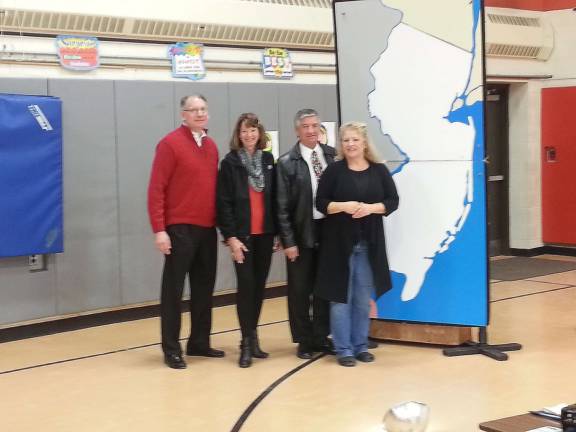 Dennis Mudrick, principal of Cedar Mountain Primary School is shown with Peggy and Dana Ziegler and Michele Van Allen. &#x201c;Welcome to New Jersey&#x201d; assemblies, sponsored by Dana and Peggy Ziegler over the past decade, were held for fourth-grade students at Cedar Mountain and Rolling Hills Primary Schools in Vernon Township on Thursday, Dec. 19. Van Allen was the presenter.