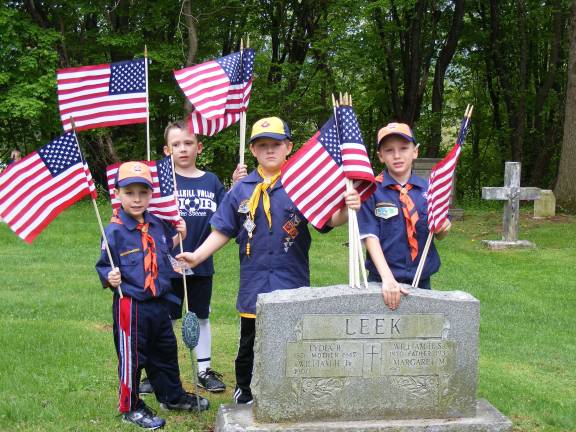 On May 11, Pack 298 assisted The Franklin American Legion in placing American Flags on the graves of Veteran's at North Hardyston Cemetery. Pictured from left are: Elijah McLean, Devon Wareka, Kenny Coffaro and Nicholas Gibson.