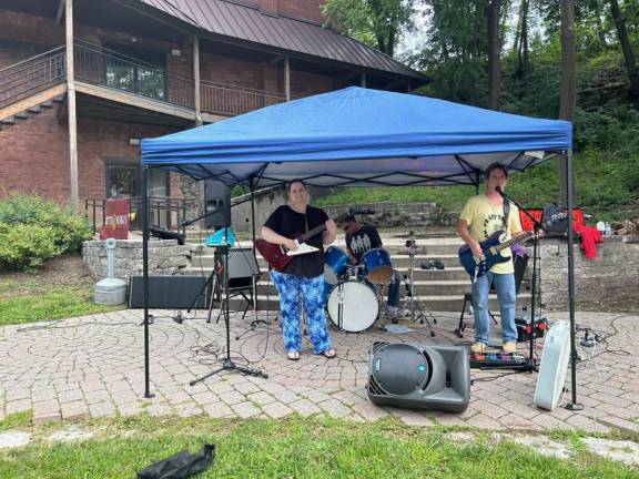 Kingsland Explosion, a local band, entertains at the event Friday, July 7.