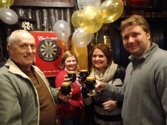 Jeff and Diane Little, of Newton, and Kerstin and Matt Martinka, of Hampton, each enjoy a glass of Krogh's 15th anniversary Russian imperial stout.
