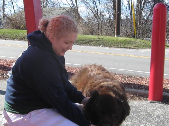 ]Hagrid, the Newfoundland, preferred a vanilla cone. His owner Katie Herz assists the big boy.