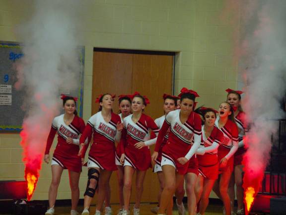 High Point Regional High School cheerleaders run onto the gym floor.
