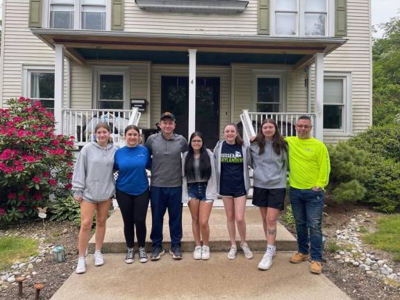 Volunteers for Pass It Along’s Day of Service pose in front of Birth Haven in Newton. From left are Sam Darmiento, Julia Hamann, Matt Hamann, Kellie Marino, Sarah Parise, Madison Kasko and Eric Martino.