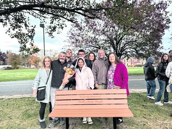 <b>Family and friends join SCCC at a bench dedication in memory of LACE student Molly Buyer.</b>