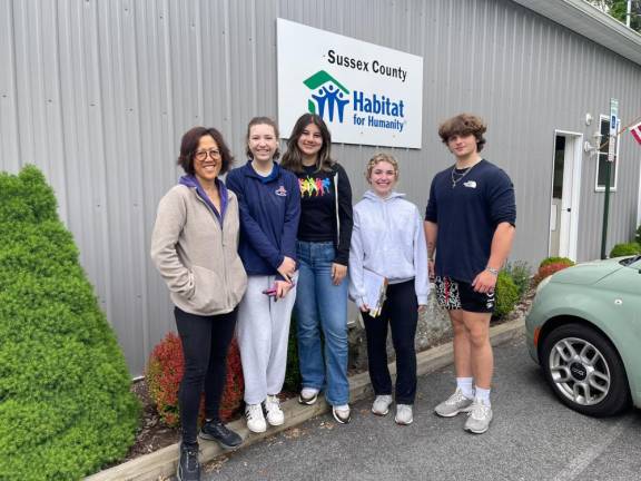 From left, Eleanor Young, Lorayne Gulbrandsen, Paula Aidaz, Ava Battiaglia and Ti Jarvi pose in front of Habitat for Humanity of Sussex County in Newton.
